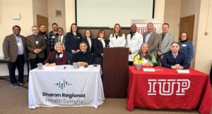 Group photo of healthcare and university professionals.