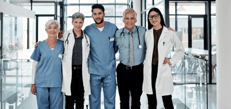 Medical team smiling in hospital hallway
